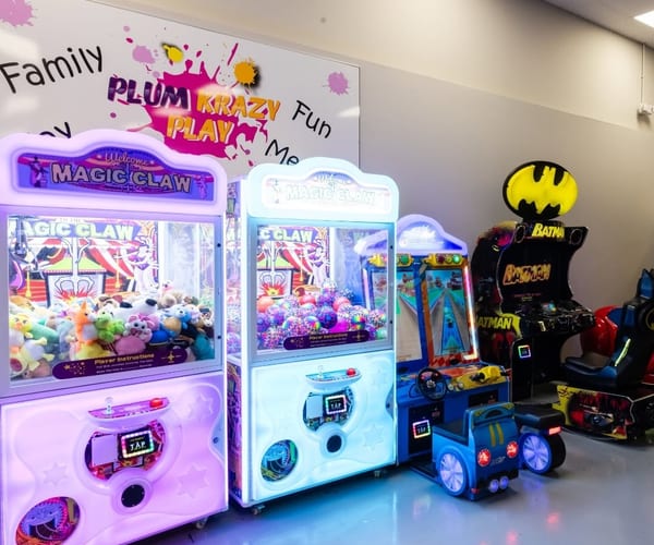 Kids enjoying arcade games at Plum Krazy Play