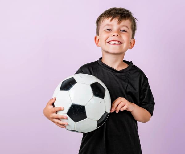 Children playing in the sports zone at Plum Krazy Play